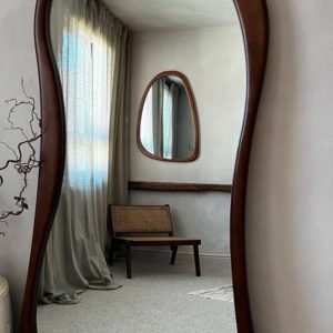 Elegant wavy full-length mirror with brown wooden frame