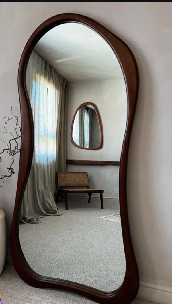 Elegant wavy full-length mirror with brown wooden frame